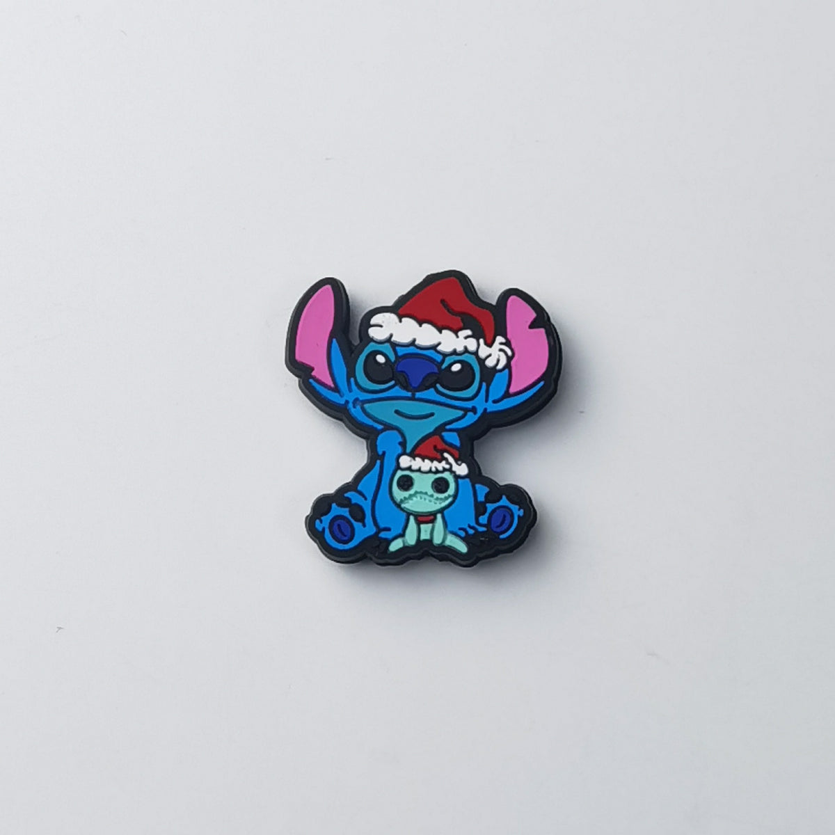 Blue Stitch silicone focal bead in red Santa hat, with smaller matching character in Santa hat underneath