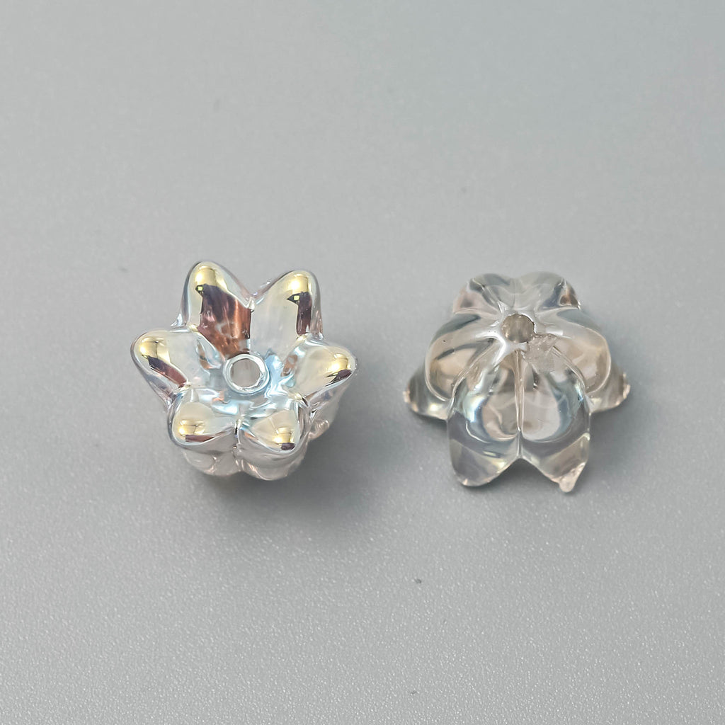 Two silver flower-shaped beads shown from front and back on a neutral gray background.