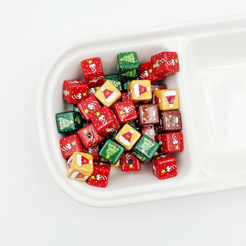 Mixed red, green, yellow and brown square Christmas beads in a white divided tray