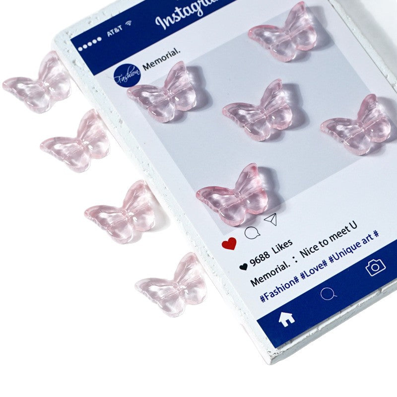 Translucent pink butterfly-shaped glass beads arranged around a smartphone mockup