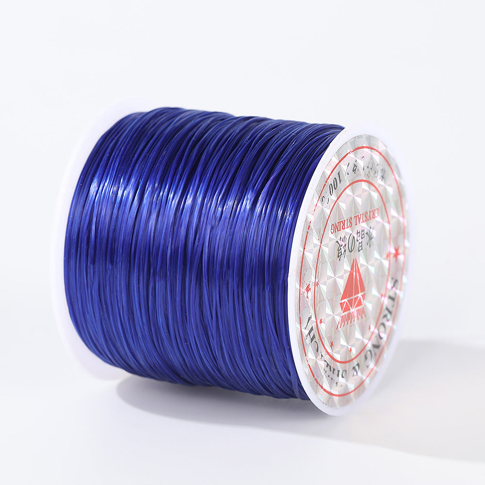 Spool of vibrant blue 0.8mm flat elastic beading cord lying on its side, diamond logo label, white background