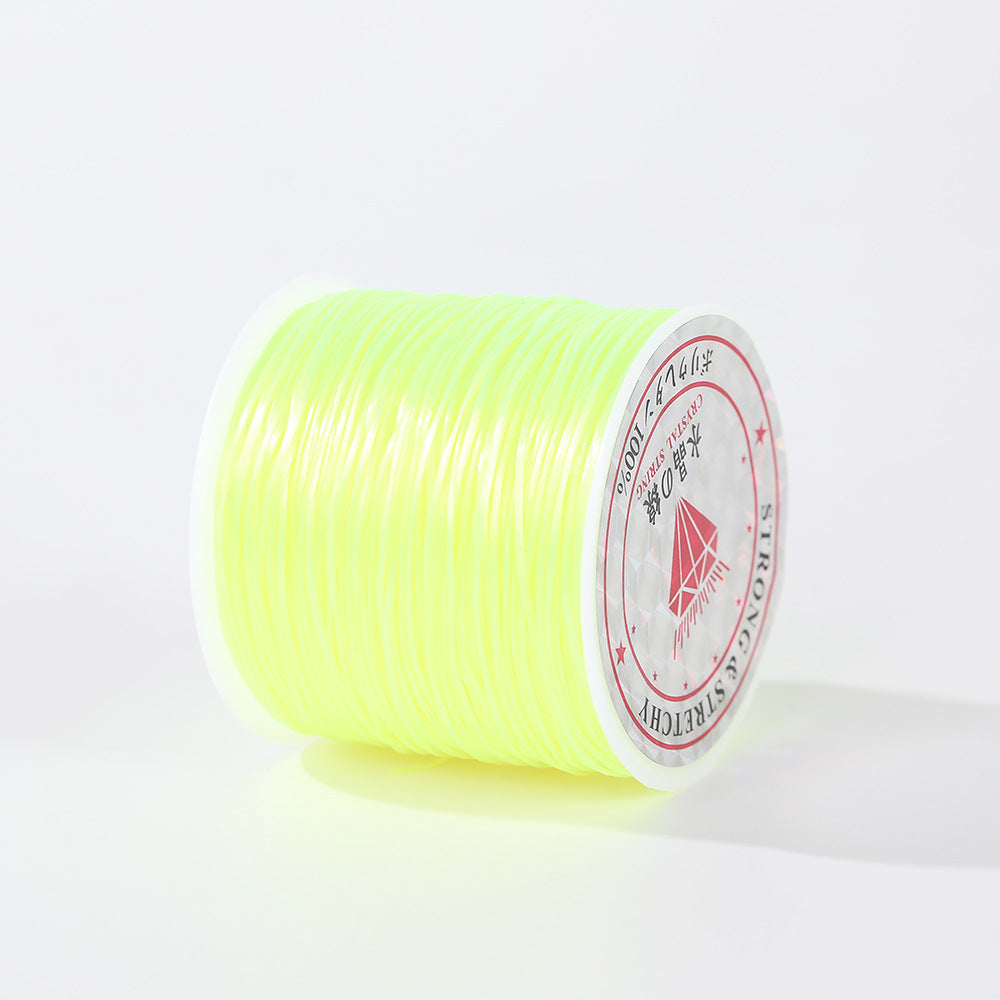 Bright neon yellow 0.8mm flat elastic beading cord spool at an angle, white label with red diamond logo, white background