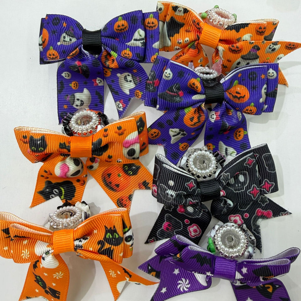 Group of Halloween ribbon bow focal beads with crystal centers in orange, purple, and black