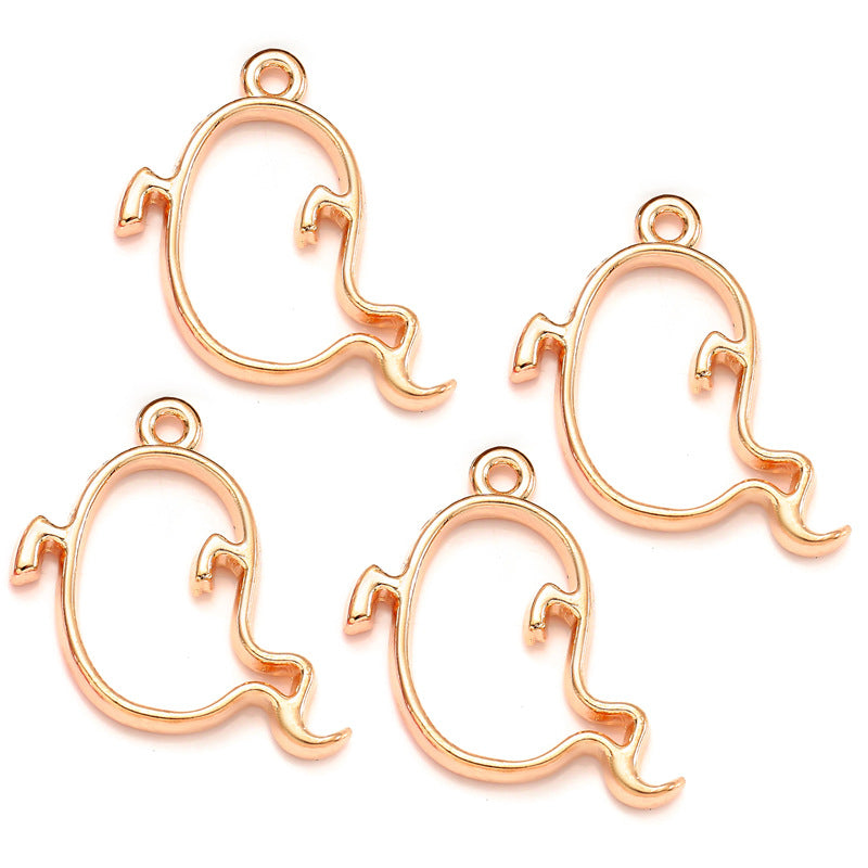 Four rose gold ghost-shaped charms on a white background
