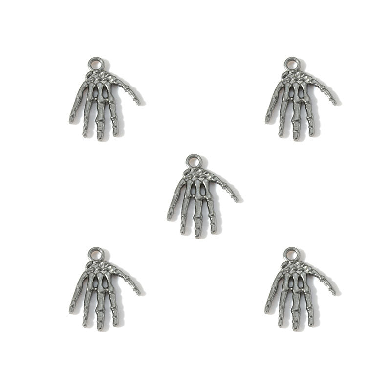 Five silver-toned skeleton hand charms arranged on a plain white background.
