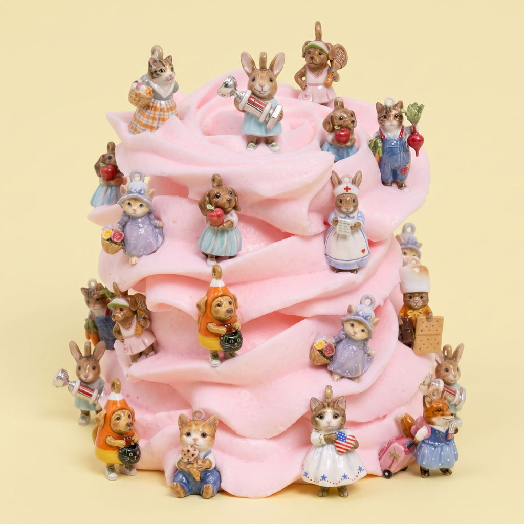Pink frosted cake decorated with small colorful 3D animal charms in various costumes.