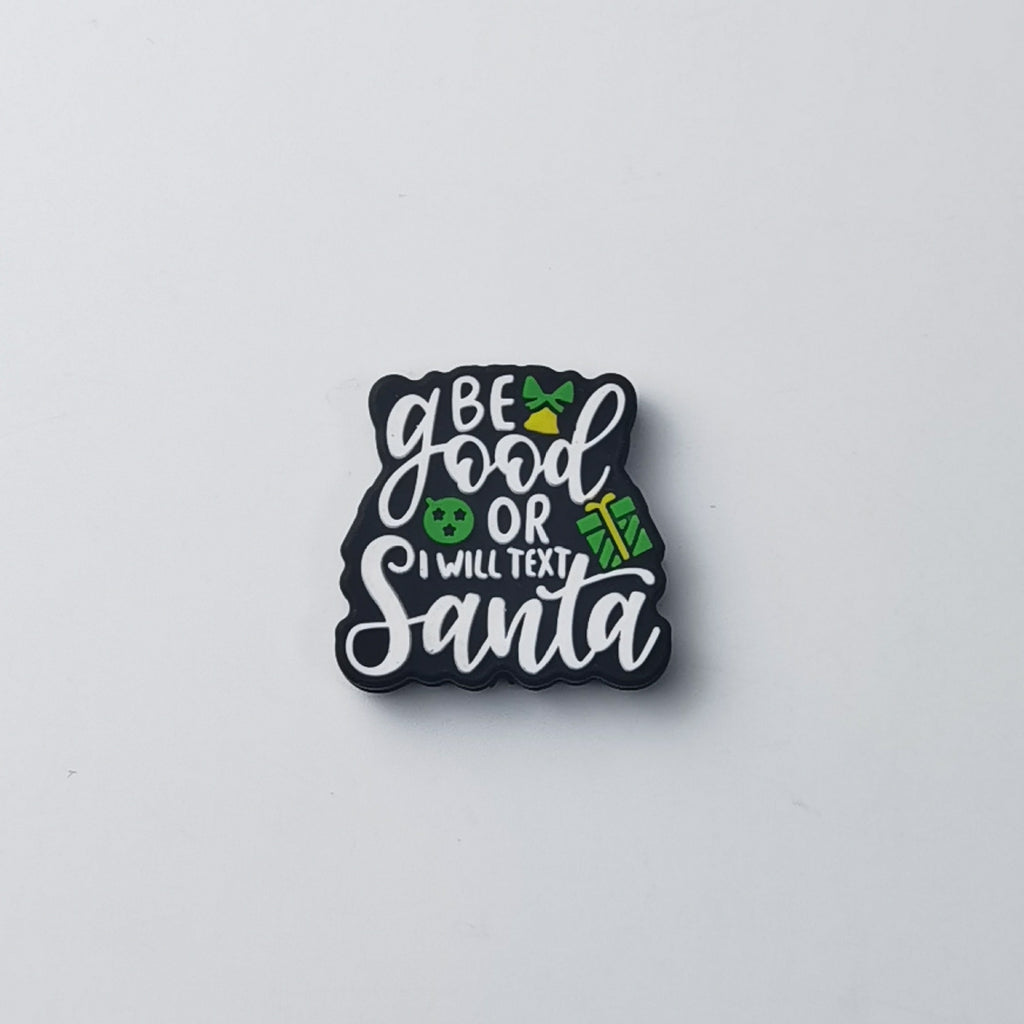 Black square silicone focal bead with white script text reading 'Be good or I will text Santa'