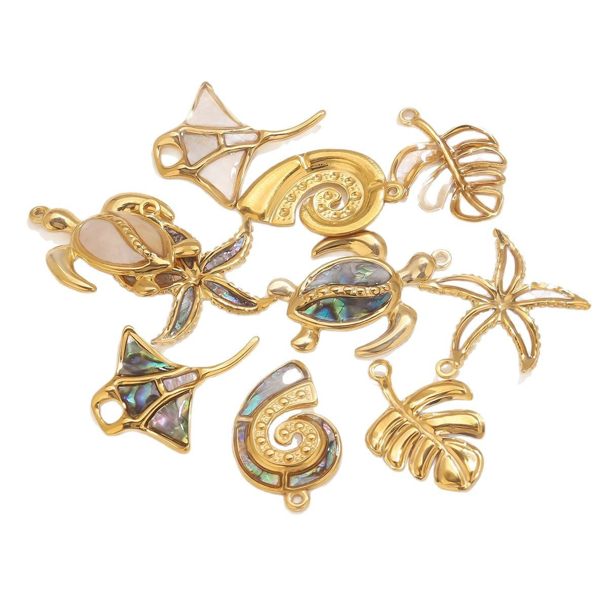 Gold ocean charm set with white shell and abalone inlay