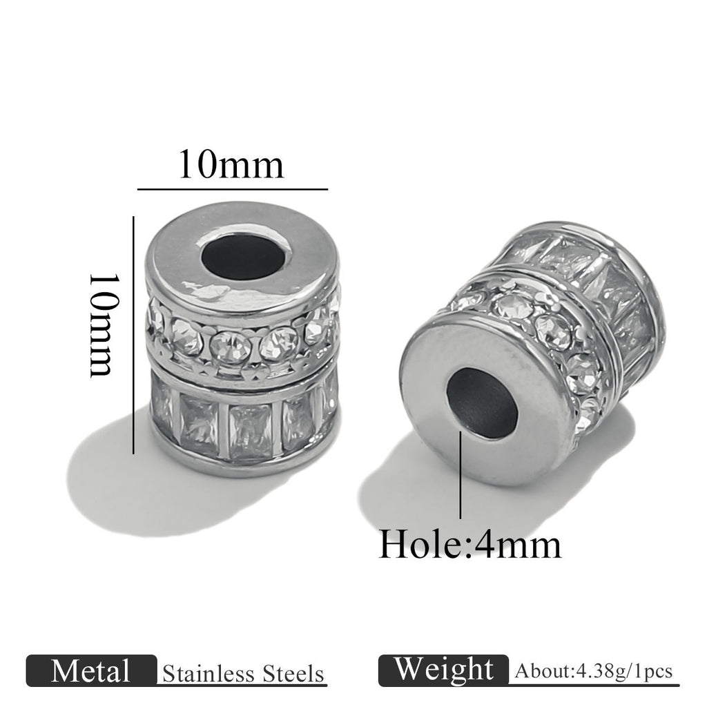 Two silver-toned cylindrical bead spacers with clear rhinestones, shown on a white background with dimension labels indicating 10mm width and 4mm hole, plus text noting stainless steel material and about 4.38g per piece.