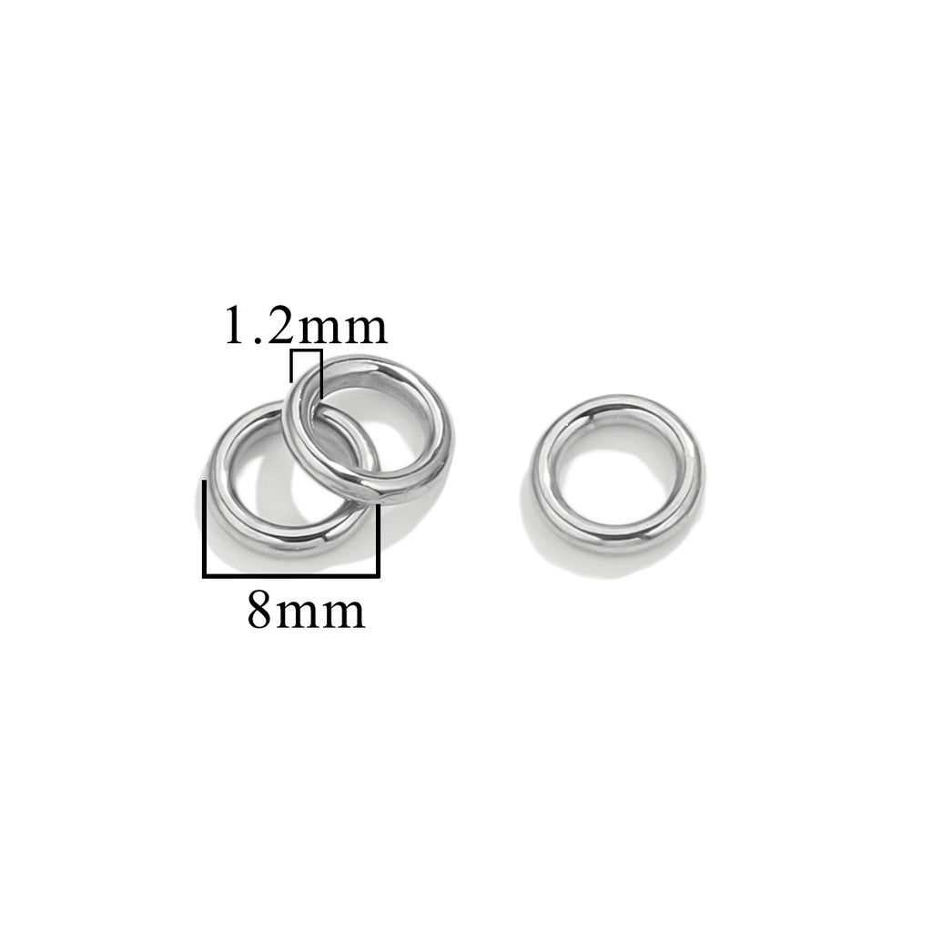 Three silver-tone closed jump rings, 8mm size with 1.2mm wire thickness, on white background