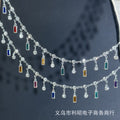 Silver double-row chain with dangling clear crystal beads and rectangular colorful gemstones
