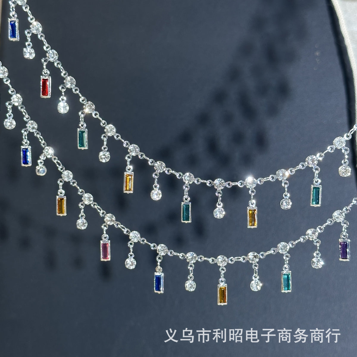 Silver double-row chain with dangling clear crystal beads and rectangular colorful gemstones