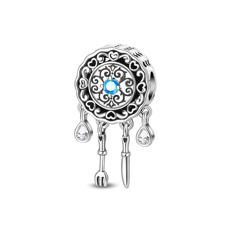 Silver-plated round filigree bead with blue crystal center, crystal teardrop and fork and knife dangles
