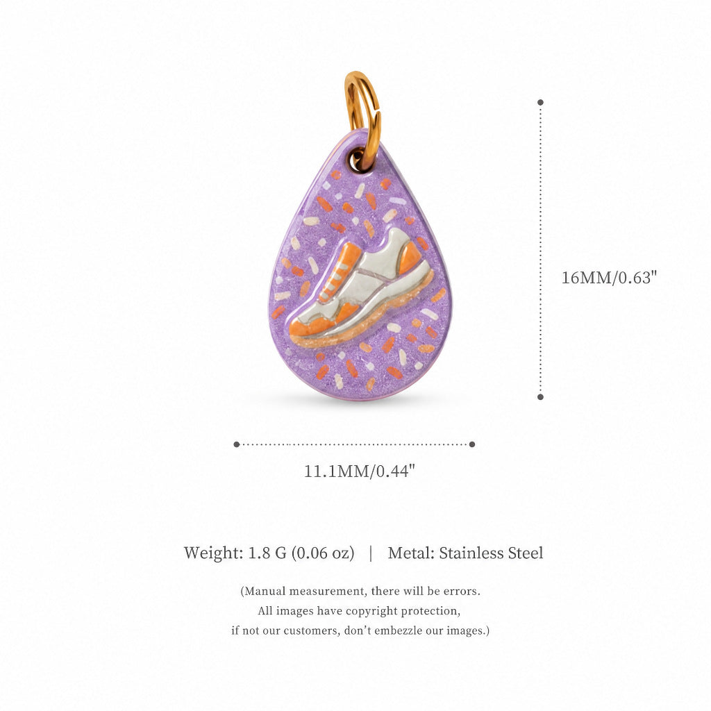 Teardrop purple sneaker charm pendant with orange speckles, shown with size measurements.
