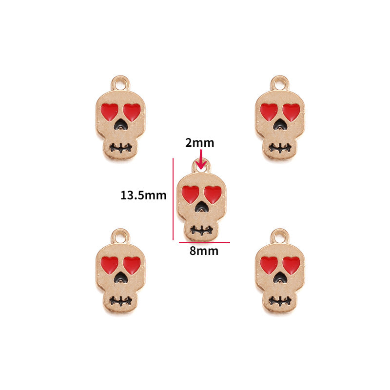 Five skull charms with red heart eyes and black stitching, 13.5mm