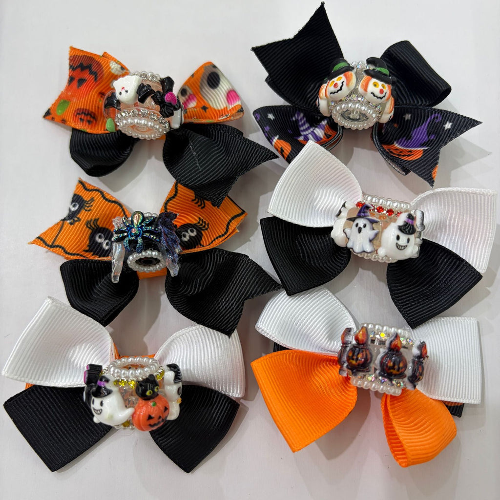 Halloween bow focal beads with pumpkin, ghost, and skull charms in black, white, and orange