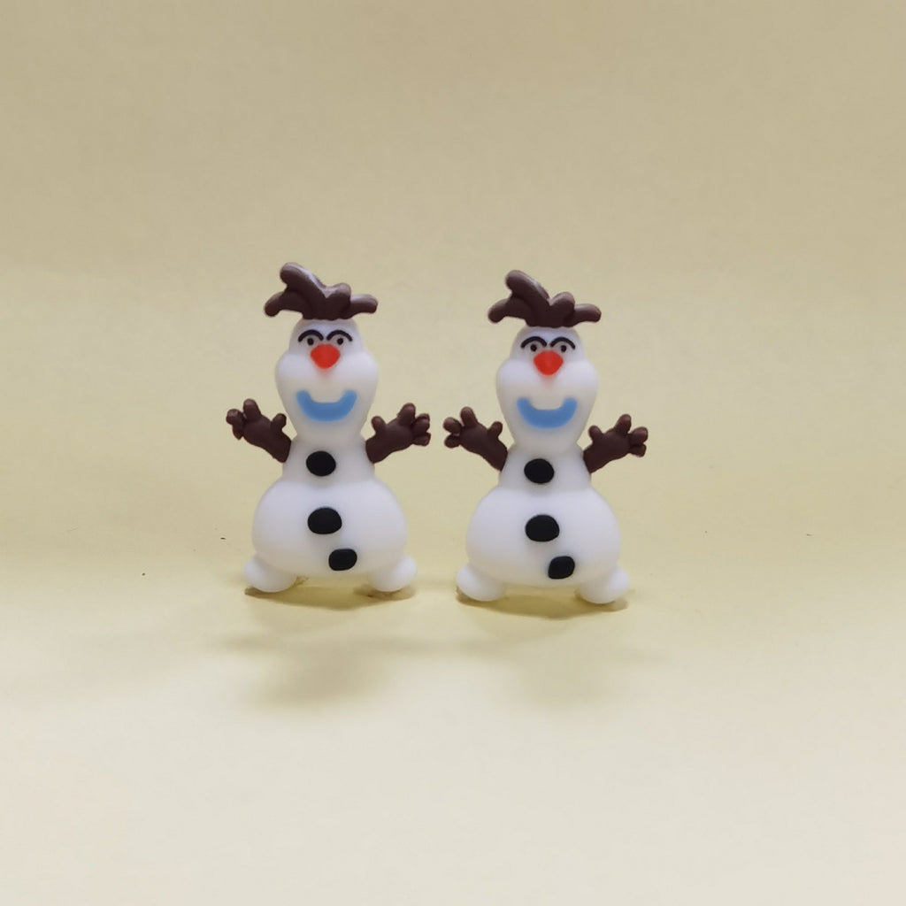 Two snowman silicone focal beads with red noses, blue smiles and brown hats