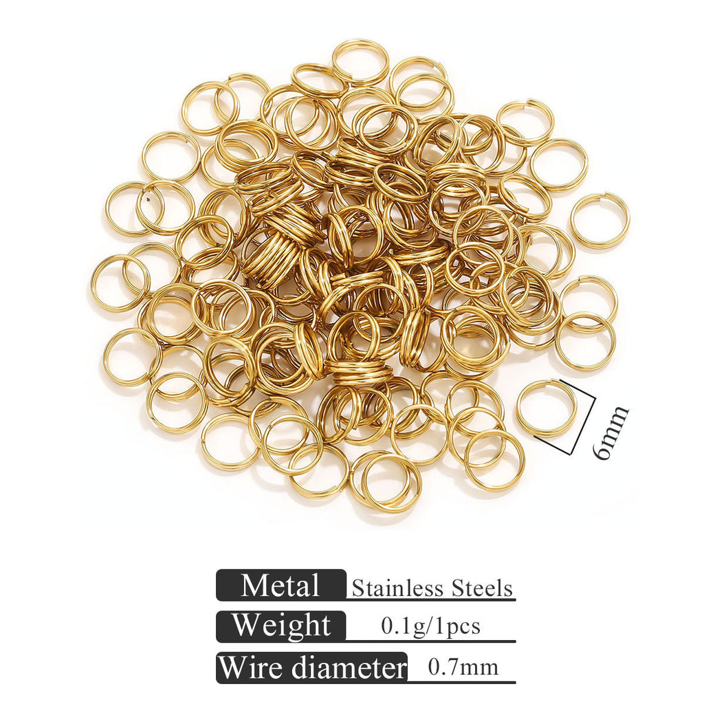 Small gold-colored stainless steel jump rings on white with 6mm size indicator