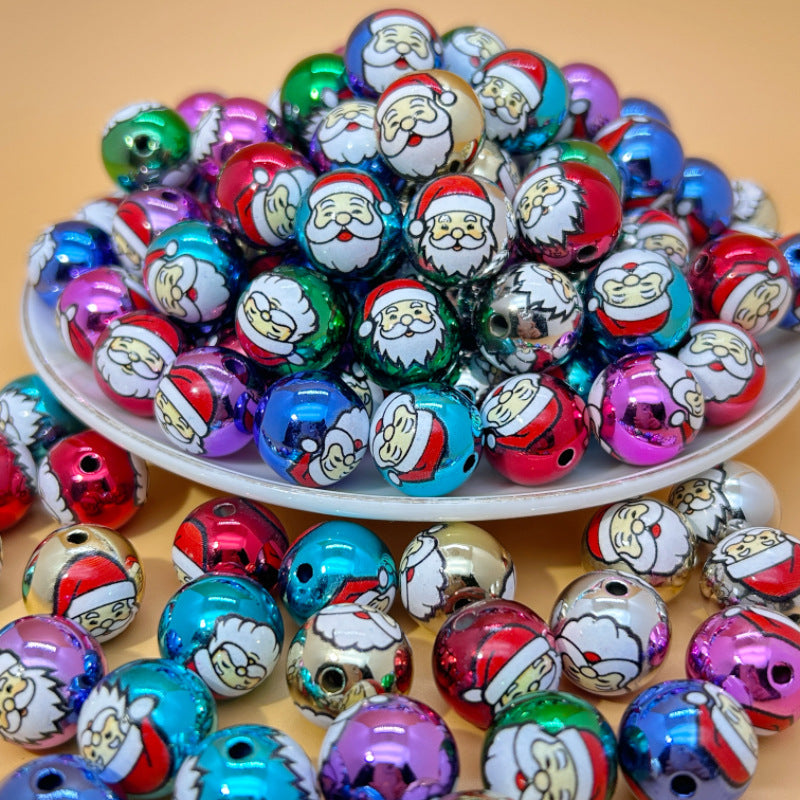 Colorful metallic Santa Claus printed acrylic round beads on a white plate with some scattered around