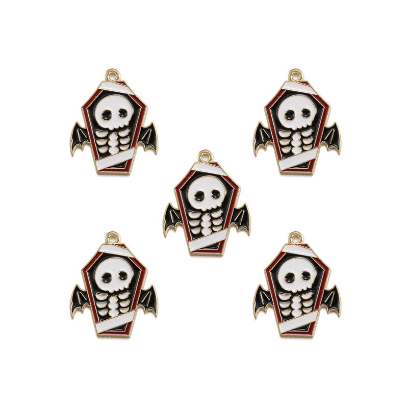 Five coffin-shaped enamel charms featuring a white skull and ribbed skeleton design, with black bat wings, red trim, and gold-tone metal borders on a plain white background.