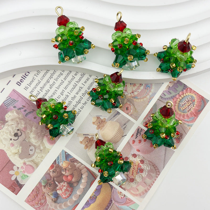 Six green Christmas tree-shaped pendant charms with gold-tone frames and red crystal ornaments