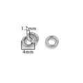 Three silver-tone closed jump rings, 4mm size with 1.2mm wire thickness, on white background