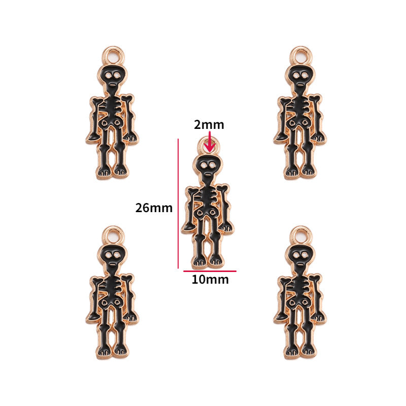 Five black and rose gold skeleton charms, 26mm by 10mm