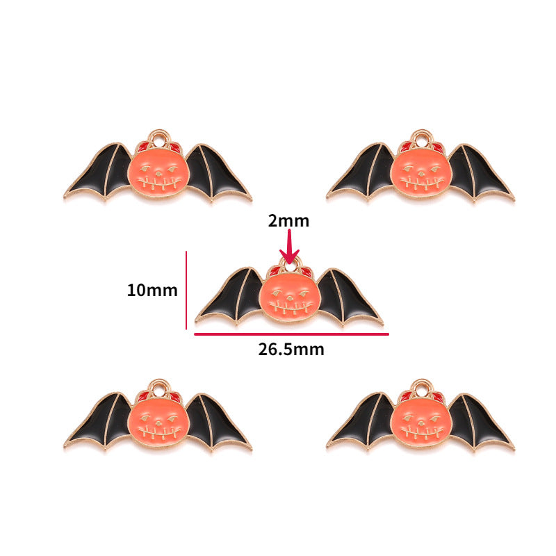 Five bat charms with black wings and orange pumpkin faces, 10mm by 26.5mm