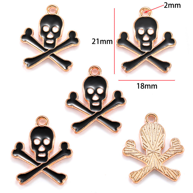 Five black enamel skull and crossbones charms with rose gold borders, 21mm by 18mm