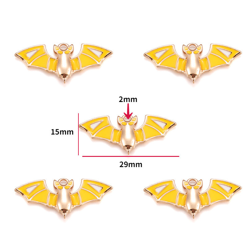 Five yellow and rose gold bat charms, 15mm by 29mm