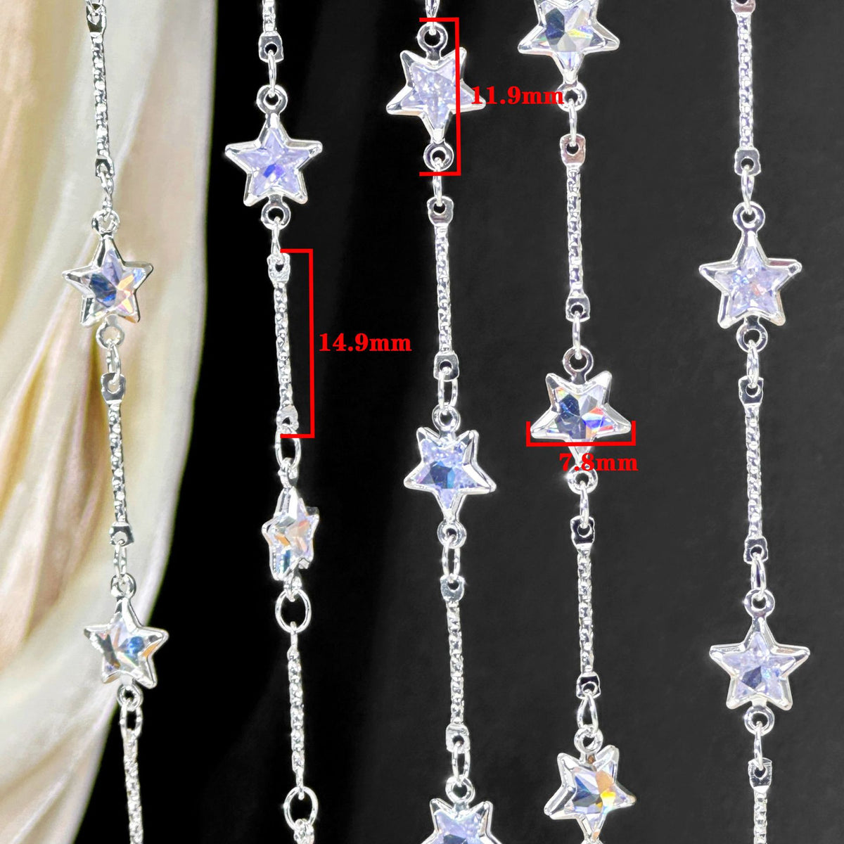 Silver-tone star-shaped beaded curtain or door hanging chain with clear rhinestone-embellished stars, shown against a black background with red dimension callouts indicating measurements.