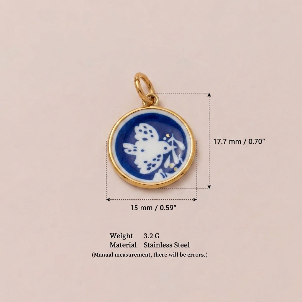 Round pendant charm with blue and white butterfly in gold bezel, shown with size measurements.