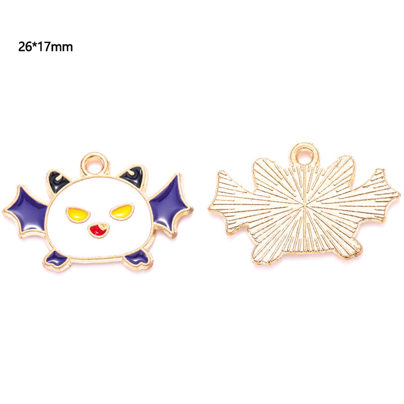 Two small bat-shaped charms with purple wings and white face, front and back, 26 by 17mm