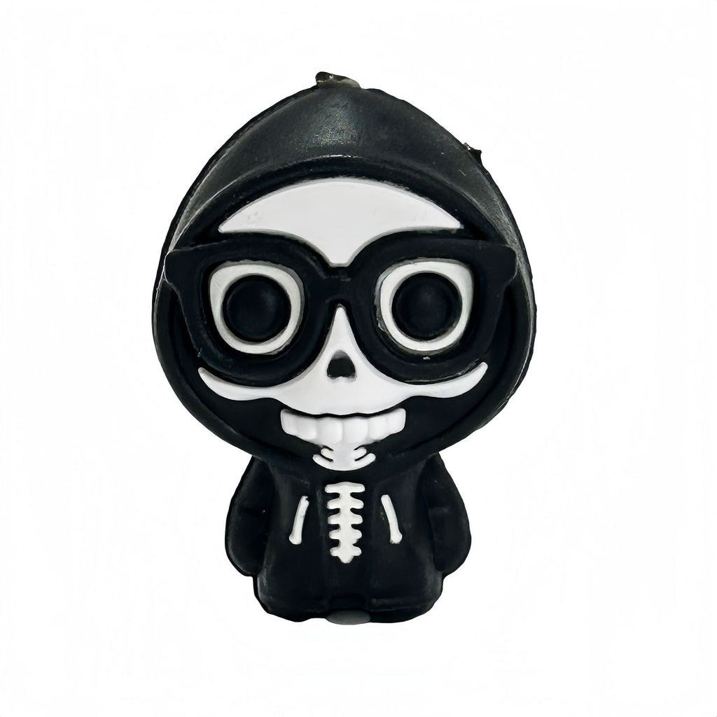 Black and white silicone skeleton focal bead with cartoon skull face and glasses