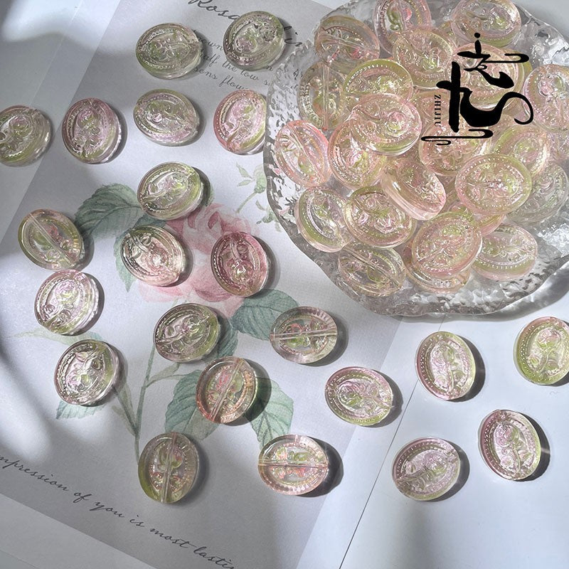 Iridescent engraved glass rose beads in soft pink, green, and gold