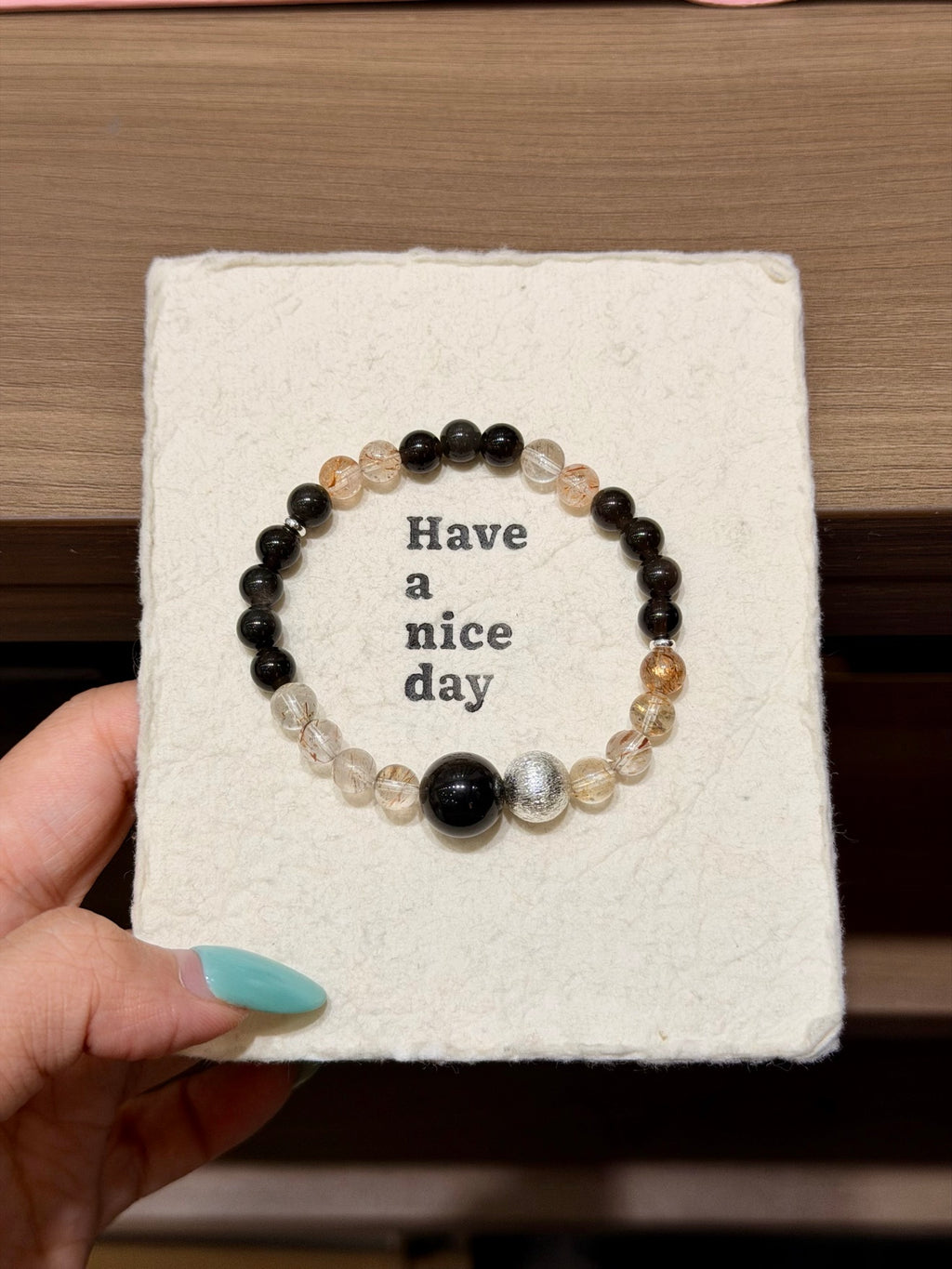 Black gold super seven and silver obsidian bracelet on Have a nice day card