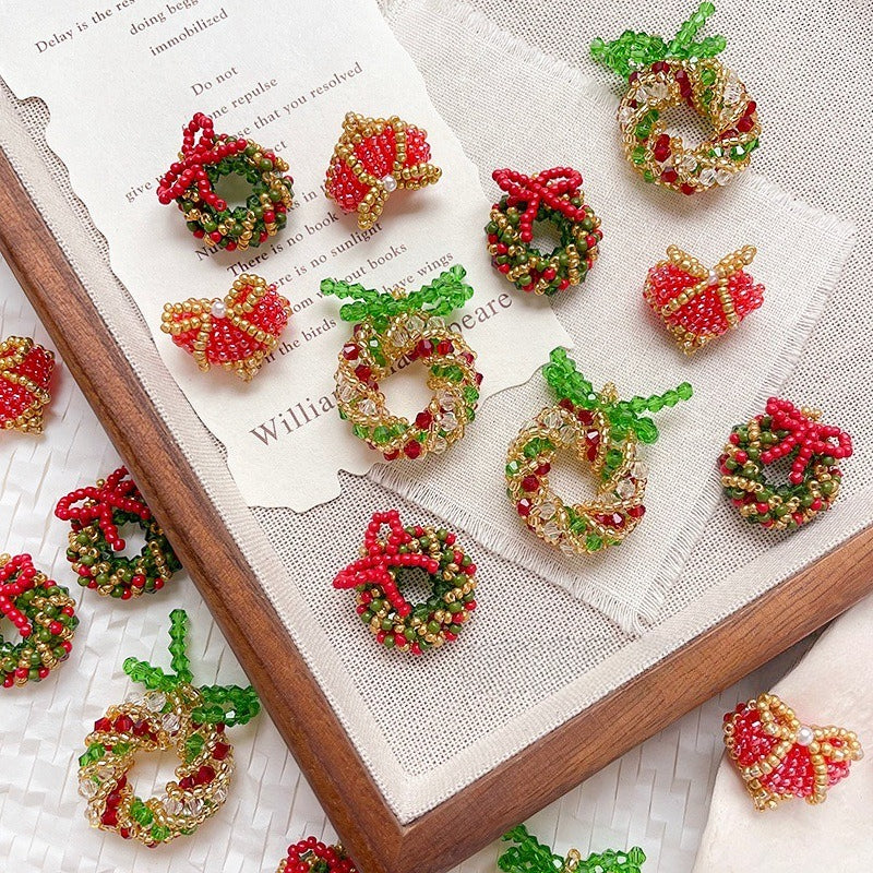 Beaded Christmas wreath and heart ornaments with red bows in red, green, and gold seed beads