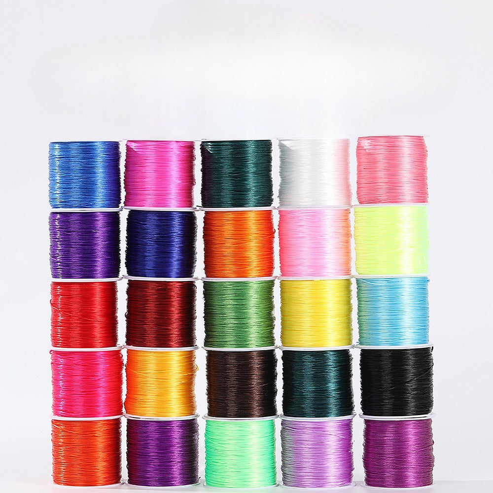 Stacks of multicolor 0.8mm flat elastic beading cord spools in five rows