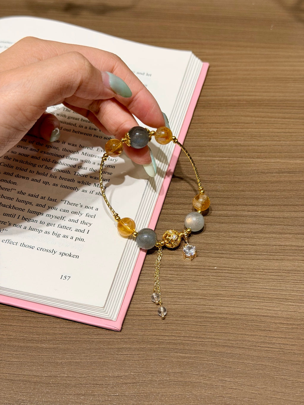 Moonfall Golden Tower bracelet with gray moonstone, yellow tower crystal, and zircon pendant on card