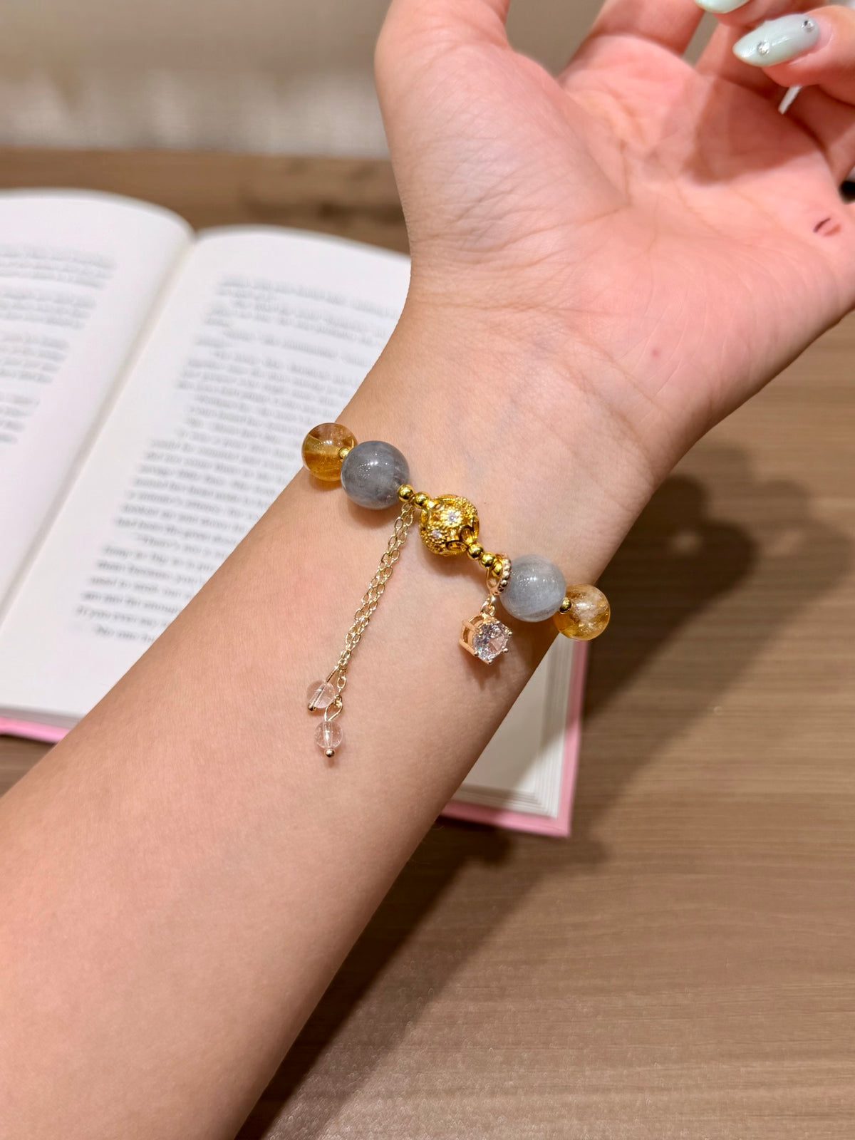 Moonfall Golden Tower bracelet with twisted gold band reflected in mirror