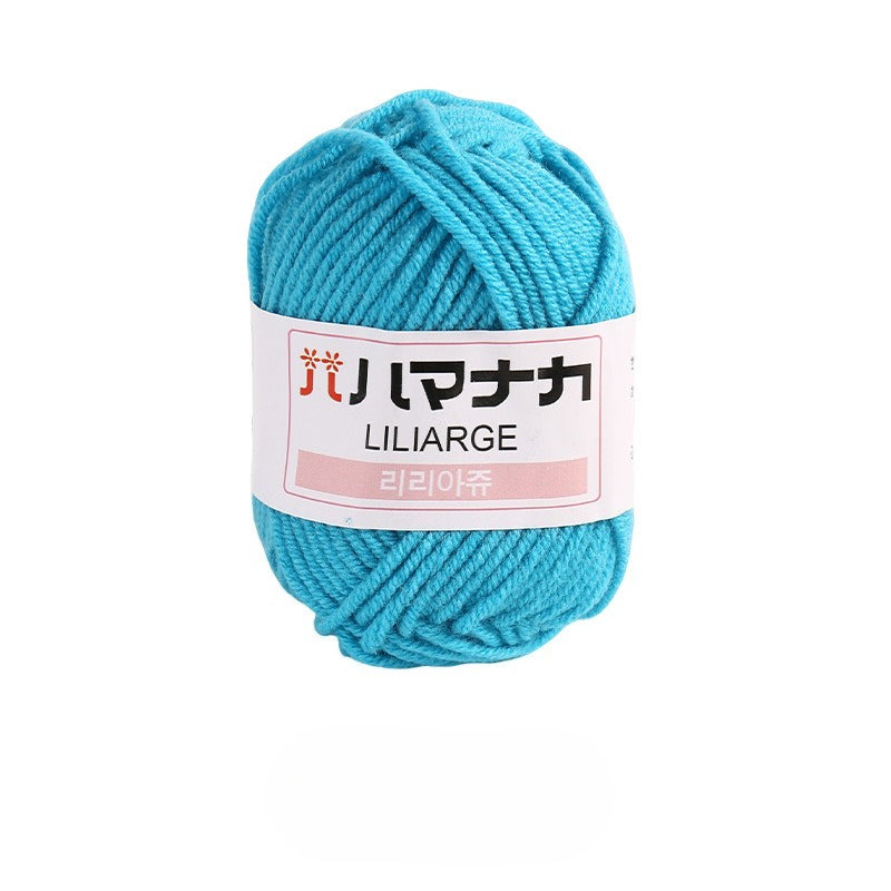 Lake blue 4-ply milk cotton-acrylic yarn skein with white LILIARGE label on white background