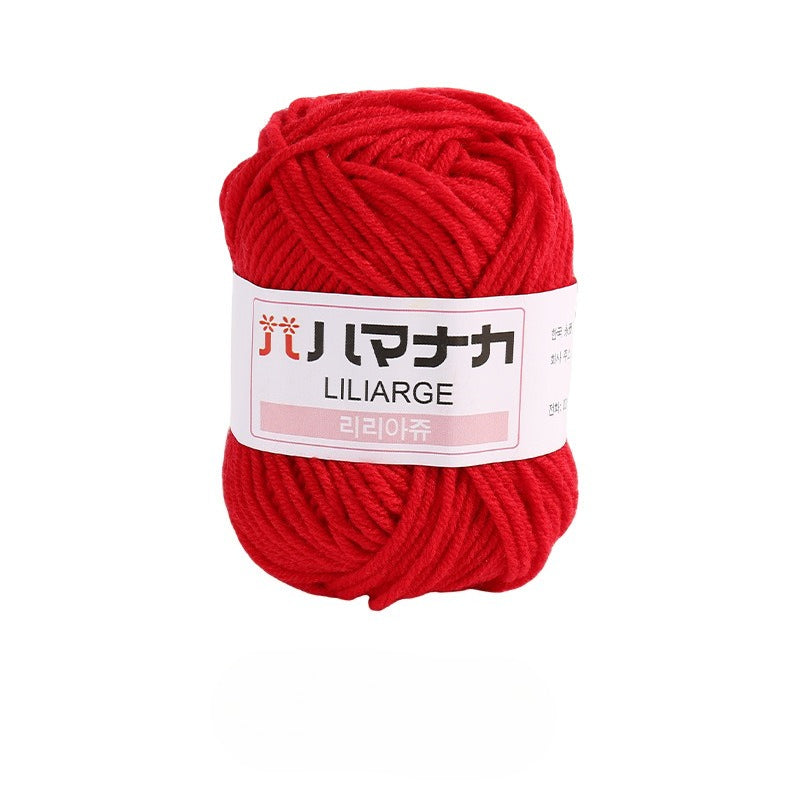 Jujube red 4-ply milk cotton-acrylic yarn skein with white LILIARGE label on white background