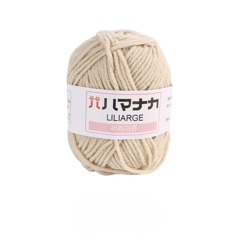 Khaki white 4-ply milk cotton-acrylic yarn skein with white LILIARGE label on white background
