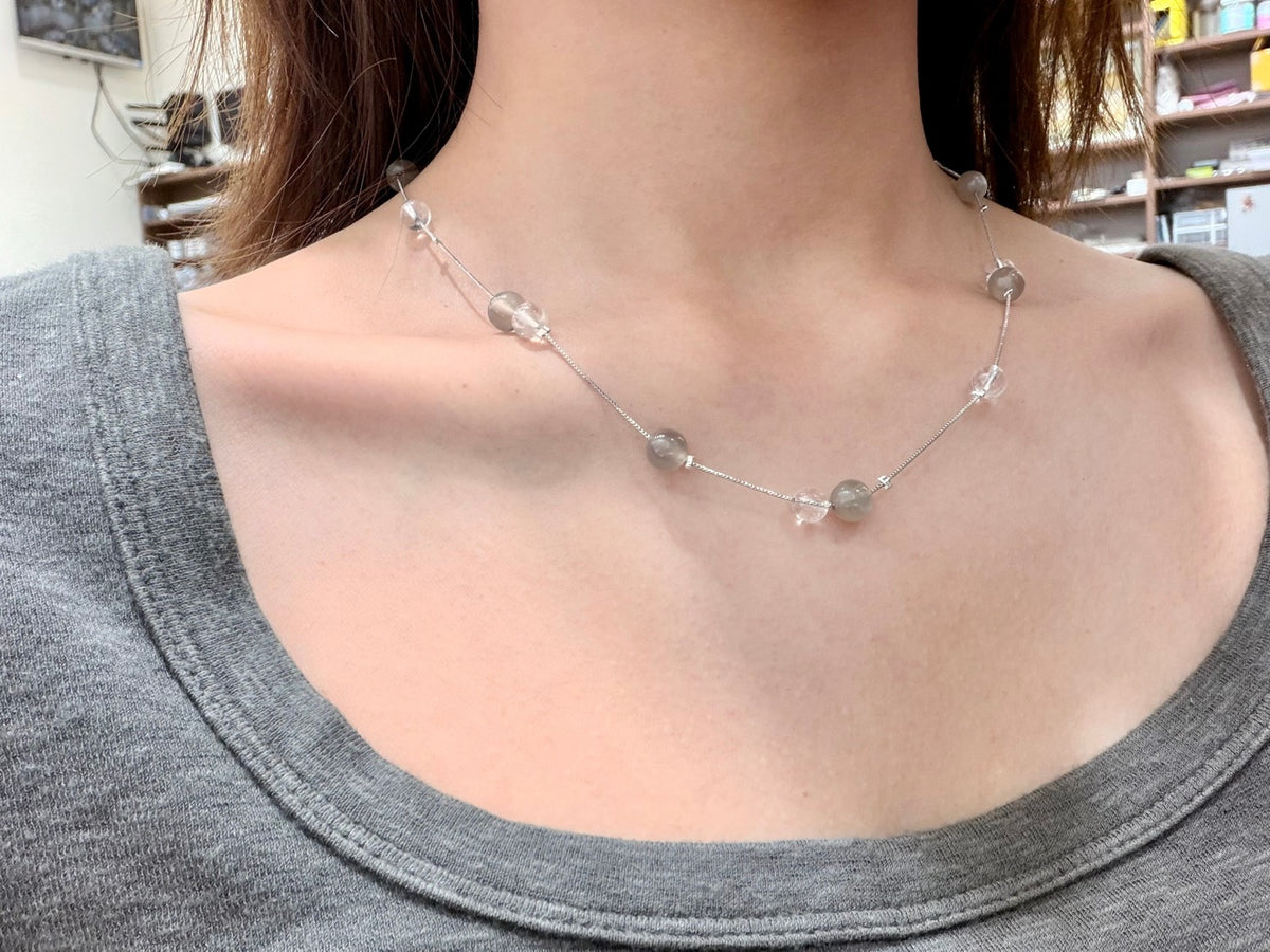 Misty moon necklace with white crystal and milk tea moonstone beads worn on neck