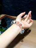 Crystal Bubble Reverie bracelet on wrist — oversized AA-grade white quartz beads with bubble-bright clarity