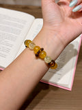 Golden wind citrine and tiger's eye bracelet worn on wrist