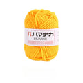 A skein of bright yellow yarn with a white paper label that reads 'LILARGE' and Japanese text, set against a plain white background.