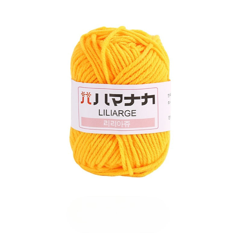 A skein of bright yellow yarn with a white paper label that reads 'LILARGE' and Japanese text, set against a plain white background.