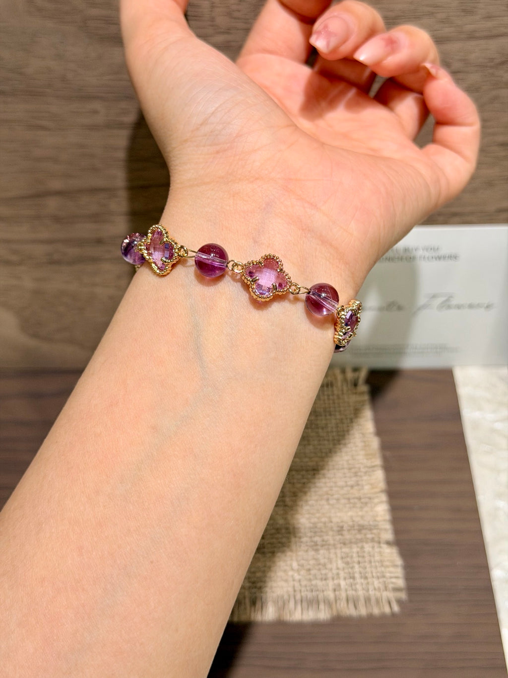 Purple Rhythm amethyst four-leaf clover bracelet on wrist
