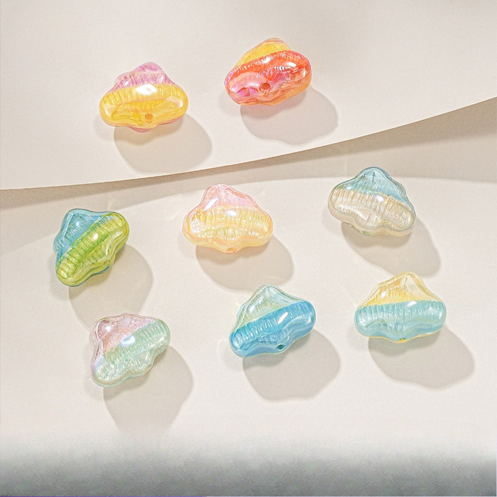 Nine translucent cloud-shaped resin beads in pastel pink, yellow, orange, green, blue, and clear.